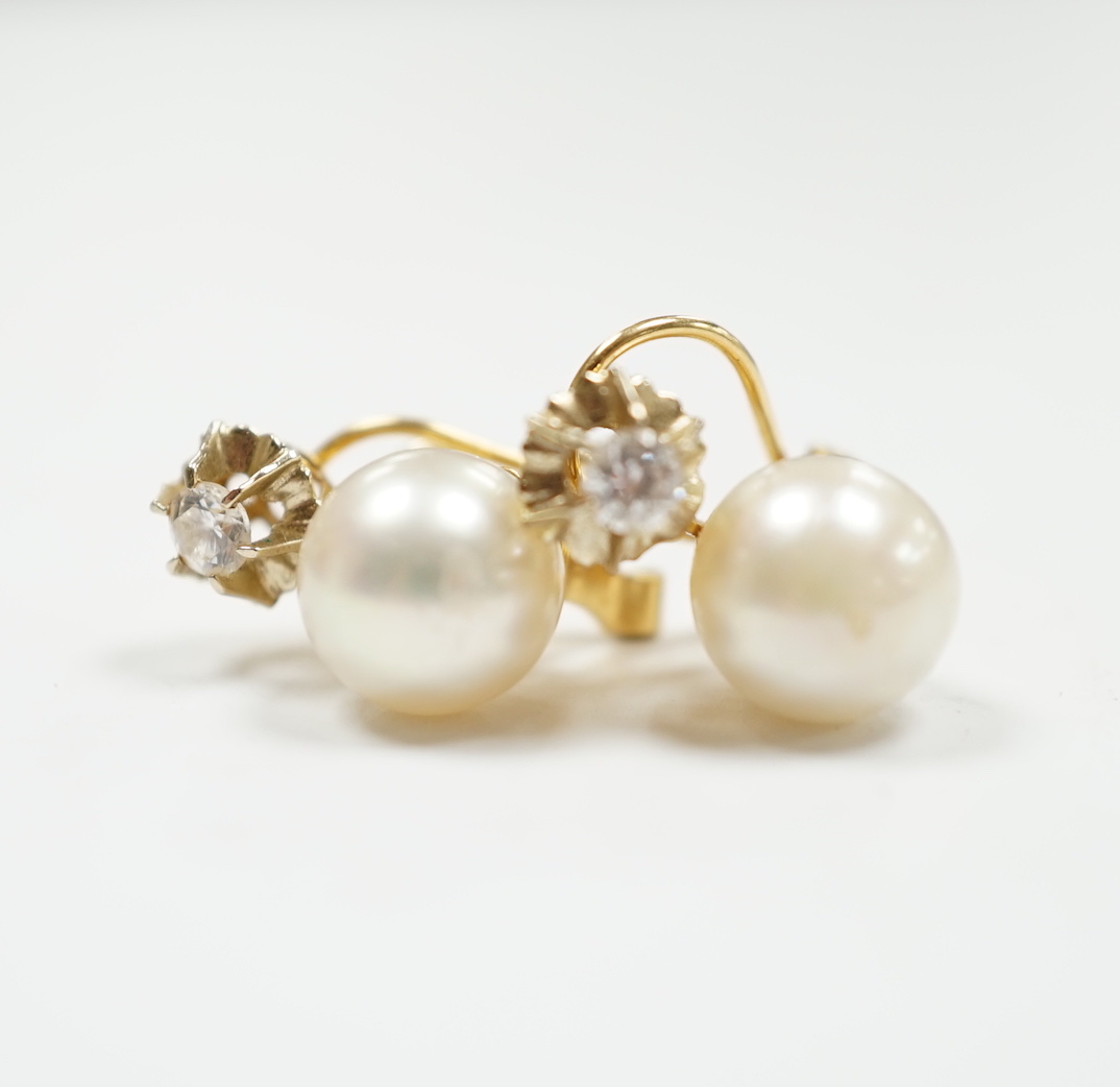 A pair of yellow metal, cultured pearl and simulated diamond set two stone earrings, 15mm, gross weight 4.3 grams.